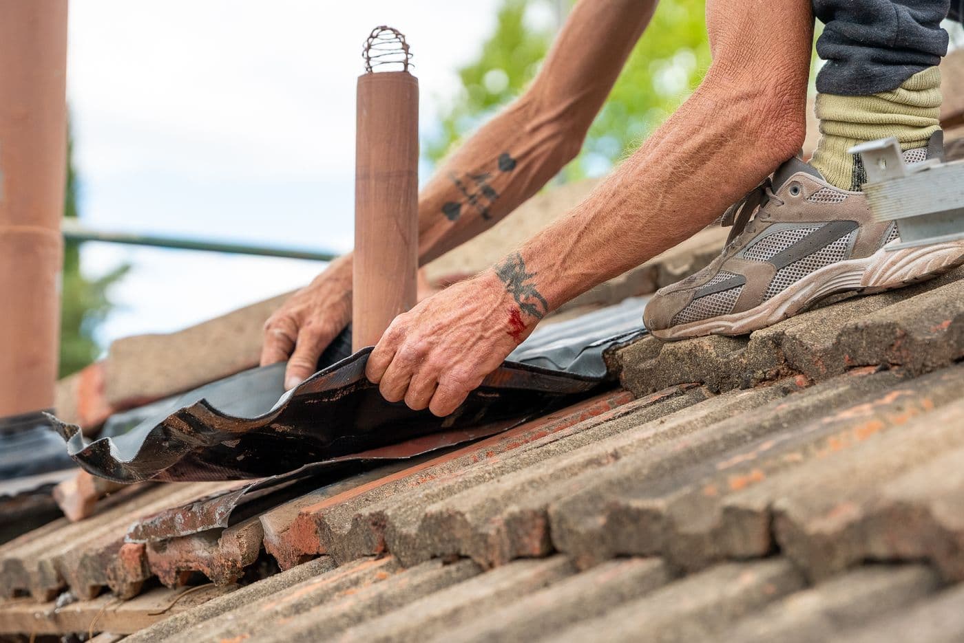 Sealing a new flashing around a vent pipe on a terracotta tile roof