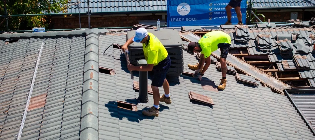 leaky roof team removing tiles leaky roof team removing tiles